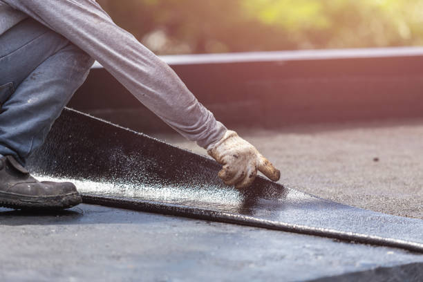 Professional Basement Waterproofing technician working in Oakwood, PA